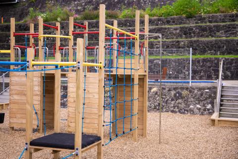 exterior shot of a wooden playground with bark 