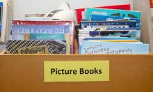 A box of picture books with a label on the front 