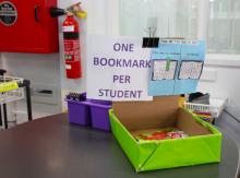 Photo of a library tray with a bookmark sign 